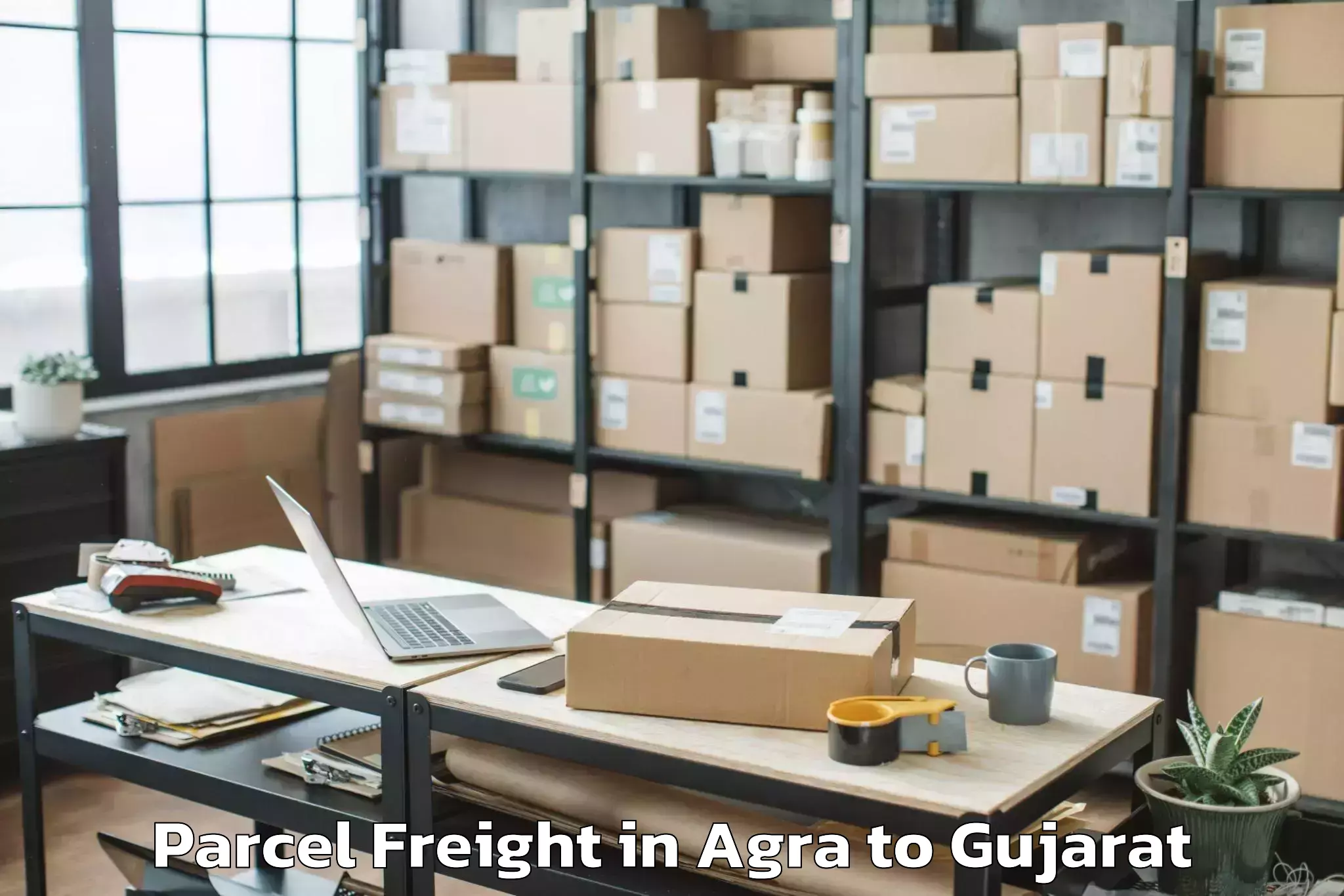 Top Agra to Dhoraji Parcel Freight Available